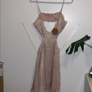 Pink satin dress with white lace trimming